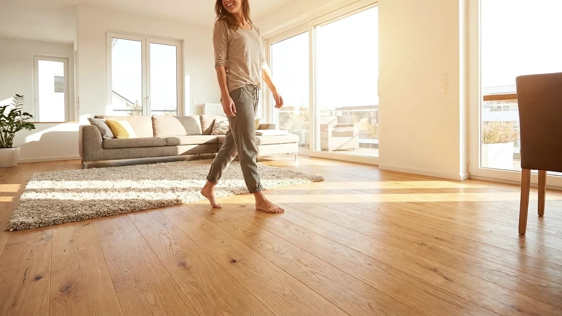 Homeowner walking on beautiful new hardwood floors